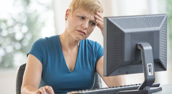 image of stressed women on computer